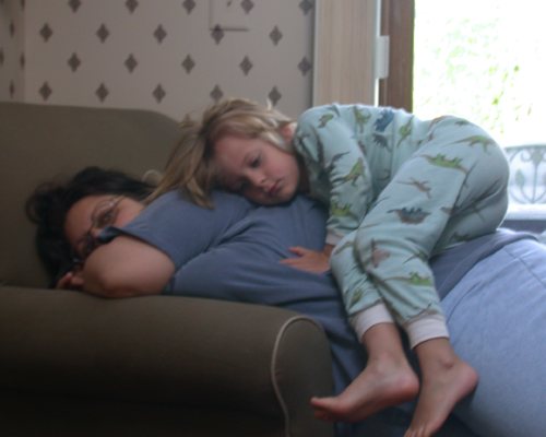 I don't know how this came about, but this is my granddaughter, Dakota, sleeping on my daughter, Beth.