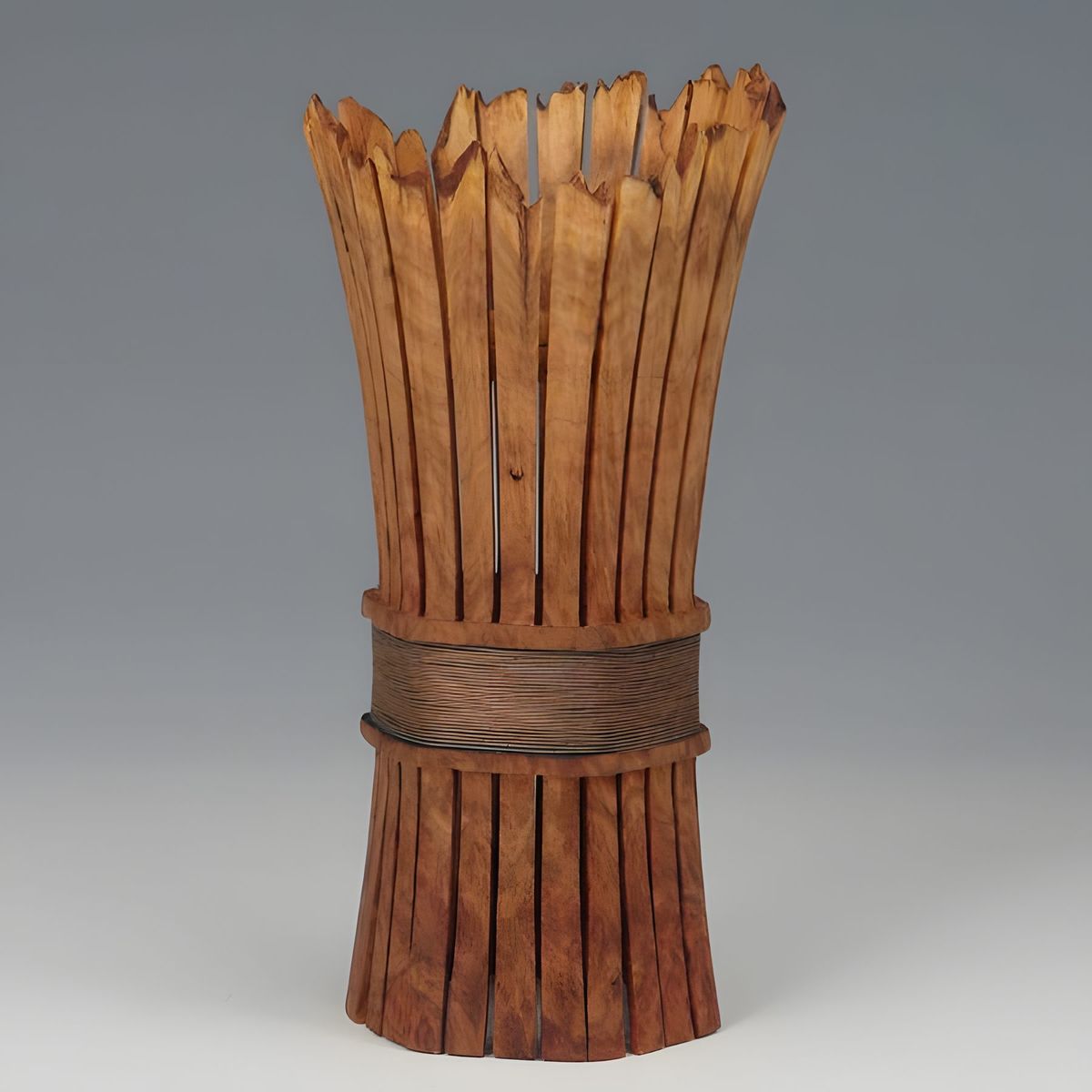 5" high by 3" diam, 5 sides, Yellow gum burl with a natural edge and patinated copper wire.