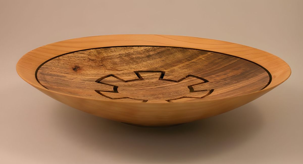 If you take the Paduk bowl, 3 pictures back and invert the top, eliminate the spout you get this.