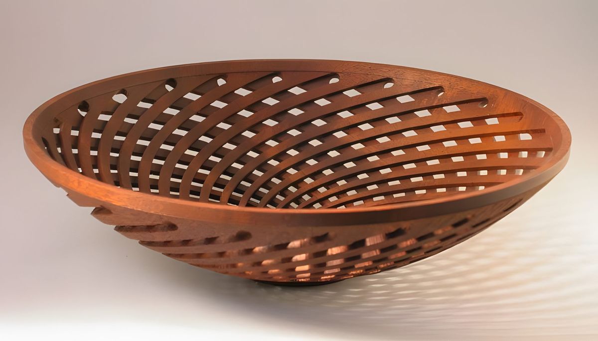 The next 2 pieces are "in development." This one was made with the bowl rotating as the cut was being made.