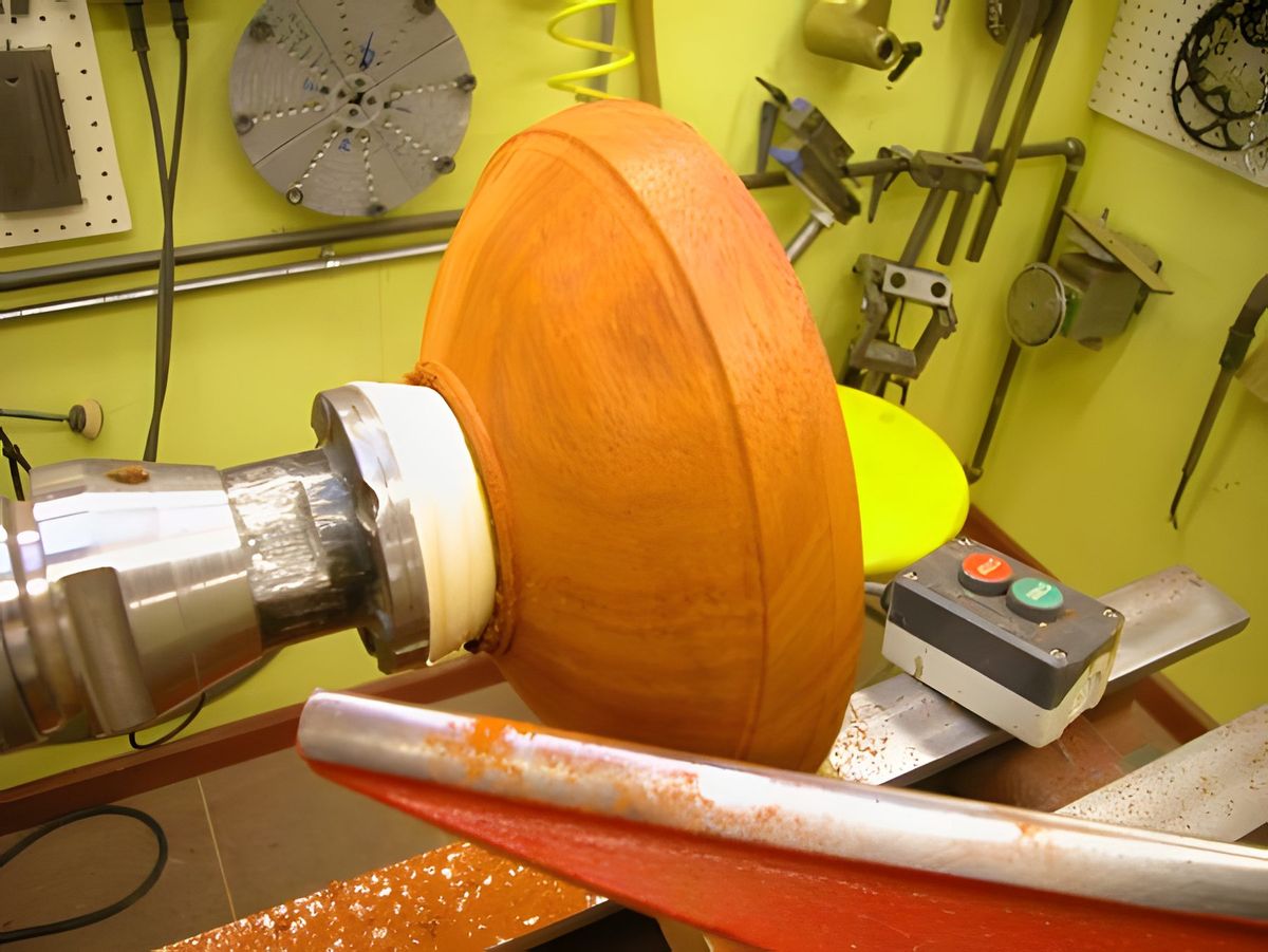 After mounting the faceplate, the piece is mounted to the lathe and turned to the desired diameter.