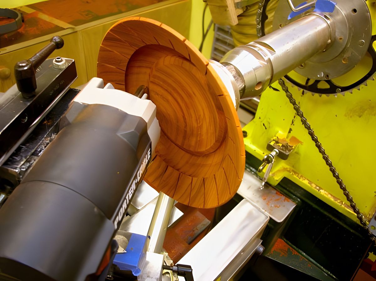 After cutting the petals I remove the 1/16" cutter and replace it with a 3/8" one and move the jig to the bottom radius…