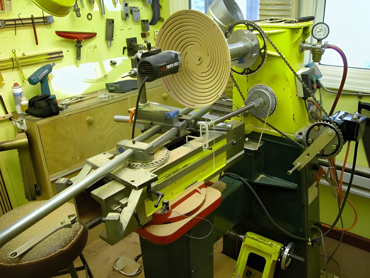 6/04 One more time. This turned out to be a real "Rube Goldberg." Turning the crank turned the screw which wound up the…